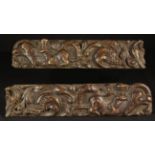 A Pair of Good Late 16th/Early 17th Century Carved Rails emblazoned with cherubs riding hook-beaked