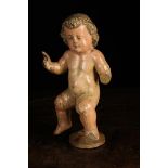 A Late 17th/Early 18th Century Polychromed Wood Carving of a Cherub mounted on an iron & wood