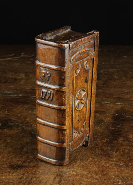 An 18th Century Dug-out Treen Snuff Box in the form of a Book, having a rich colour and patination.