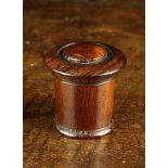 An Early 19th Century Mahogany Cased Nutmeg Grater of cylindrical form with turned screw on lid and