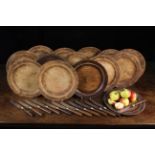 Fourteen Turned Treen Plates, 11½" (29 cm) in diameter,