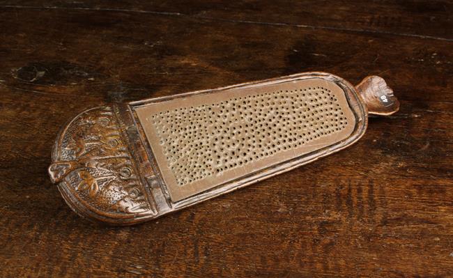 A French 17th/Early 18th Century Carved Fruitwood combined snuff grater and snuff box,