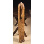 An 18th Century Mangle Board gouge carved with a series of dates; the earliest being 1726,