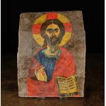 An Antique Greek Icon Portrait of Christ painted on canvas and mounted onto a bowed wooden section