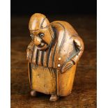 An Early 19th Century Carved Coquilla Nut Snuff Box in the form of grotesque hump backed man with