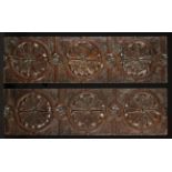 A Pair of Good Mid 17th Century Oak Panels carved with strapwork and cornflower roundels,