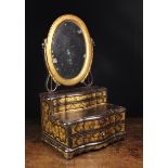 A 19th Century Black Lacquered Dressing Mirror.