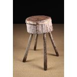 A Rustic Chopping Block composed of a cross-section of tree trunk 9" (23 cm) thick and