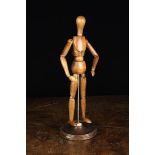 A Vintage Treen Artist's Lay Figure having articulated limbs with stylised pad hands & feet,