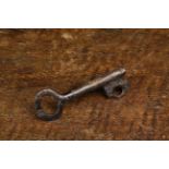 A Rare 14th Century Iron Key, 3" (7.8 cm) in length, 1¼" (3 cm) wide.