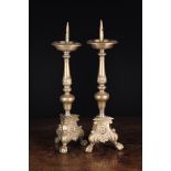 A Pair of 18th Century Bronze Flemish Baroque Pricket Sticks (A/F) Each having a candle spike