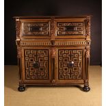 A Fabulous Mid 17th Century Flemish Carved Oak & Ebony Veneered Cupboard in two sections.