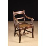 A Regency Period Welsh Oak Country Armchair having a bar back,