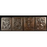 Four 16th Century Panels carved with swags of foliage having a fine colour and patination,