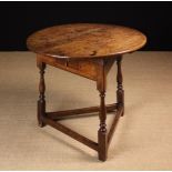 An 18th Century Oak Cricket Table of good colour and patination.