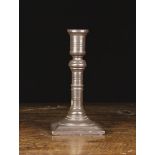 An 18th Century Welsh Turned Slate Candlestick, with ring turned column on a square moulded base,
