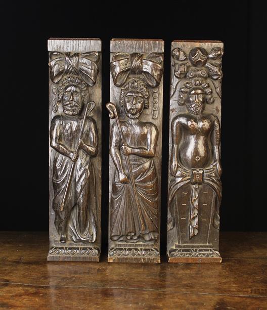 Three 17th Century Carved Oak Figural Terms: Two of them carved with a full length figure of a
