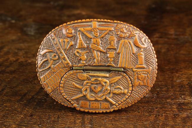 An Early 18th Century North European Oval Boxwood Snuff Box with a low releif carved scene of The
