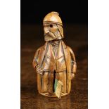 An Unusual Early 19th Century Coquilla Nut Tape Measure carved in the form of a bearded gentleman