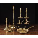 A Good Collection of mainly 18th Century Brassware: A pair of mid 18th century French candlesticks