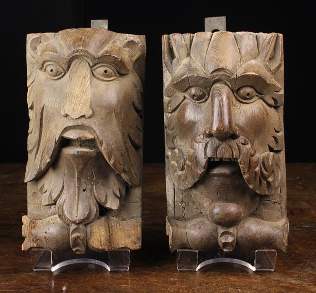 Two 19th Century Carved Oak Corbels emblazoned with face masks of a Green Man (A/F) and Satyr,