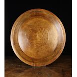 A Late 19th/Early 20th Century Treen Platter having a flat base and raised sides with a staple