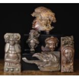 A Group of Ornamental Fragment Carvings. An oak relief of a griffins head, 4½" (11.