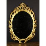 A George III Carved Giltwood Mirror.