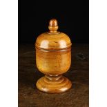 An 18th Century Turned Pearwood Spice Jar of fine colour and superb patination.