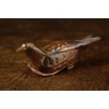 A Delightful 19th Century Stained Fruitwood Folk Art Snuff Box carved in the form of a bird nesting