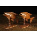 A Pair of 19th Century Pitcairn Island Souvenir Carvings of Leaping Fish on turned pedestals and