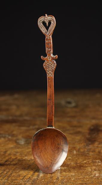 A Rare 18th Century Carved Treen Spoon of rich colour and patination.