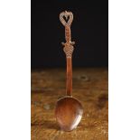 A Rare 18th Century Carved Treen Spoon of rich colour and patination.