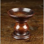An 18th Century Turned Fruitwood Pounce Pot, 3½" (9 cm) high.