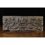 A Good 17th Century Oak Panel (A/F) boldly carved in relief with The Tree of Life: a pair of