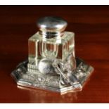 A Square Glass Inkwell with a hinged white metal dome lid mounted on a decorative base with saddle,
