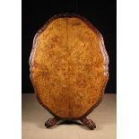 A 19th Century Irish Figured Walnut Tilt-top Table.