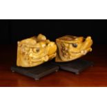 A Pair of Oriental Ochre Glazed Terracotta Architectural Finials modelled in the form of Kylin