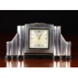 A Continental Art Deco Silver-clad Mantel Clock.