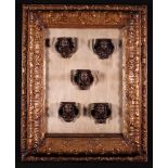 A Group of Five 17th Century Ornamental Oak Appliqués carved in the form of cherub heads and