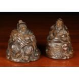 A Pair of Dark Patinated Bamboo Carvings of Seated Buddhistic Figures: One holding a Ruyi Sceptre