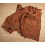 A Paisley Shawl/Throw woven with typical teardrop motifs predominately in red & olive green with