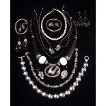 A Collection of Jewellery with a Black & Silver coloured theme: Seven necklaces,