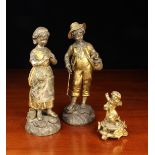 A Pair of 19th Century Silver & Gilt Patinated Spelter Figures of a boy with fishing rid and creel,
