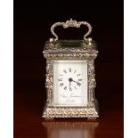 A Small Silver Carriage Clock by Charles Frodsham, hallmarked London 1978.