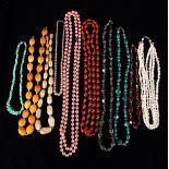 Ten Bead Costume Necklaces: Simulated pearls, faux amber, horn, malachite, glass etc.