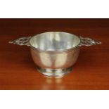 A Victorian Silver Porringer with decoratively pierced lug handles,