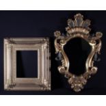 A Cartouche-shaped Wall Mirror in a carved,