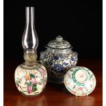 A Oriental Blue & White Lidded Jar decorated with flowers and scrolling foliage with moulded kylin