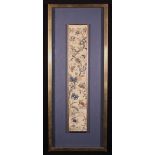 An Antique Chinese Silk Sleeve Panel embroidered with lotus flowers and chrysanthemums and a rising